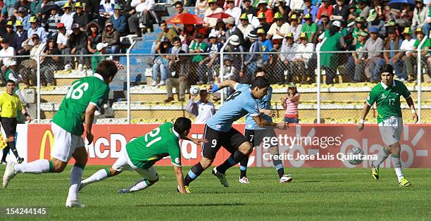 Luis suarez of Uruguay and Edwar Zenteno of Bolivia fight for the ball during a match between Uruguay and Bolivia as part of the South American...