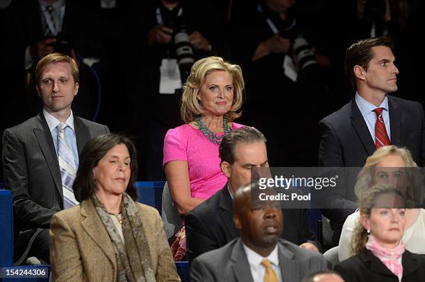 Ann Romney sits with sons Ben Romney and Matt Romney before a town hall style debate at Hofstra University October 16, 2012 in Hempstead, New York....