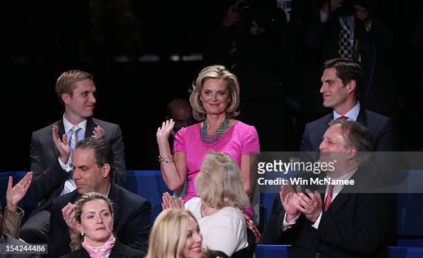Ann Romney sits with sons Ben Romney and Matt Romney before Republican presidential candidate Mitt Romney and U.S. President Barack Obama answer...