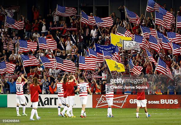 Fans cheer as the USA team applauds them after the USA defeated Guatemala 3-1 to win the World Cup Qualifying match at LiveStrong Sporting Park on...