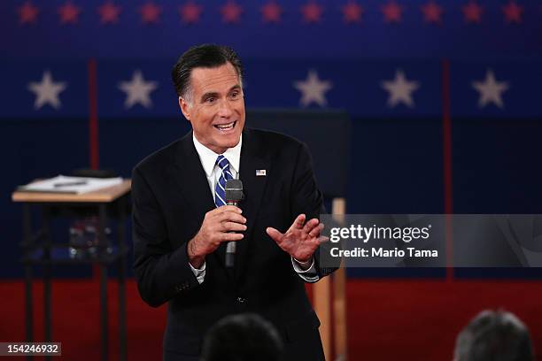 Republican presidential candidate Mitt Romney answers a question during a town hall style debate at Hofstra University October 16, 2012 in Hempstead,...