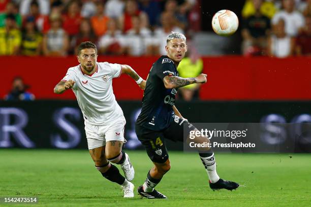 Alejandro Dario Papu Gomez of Sevilla FC and Mateo Carbajal of Independiente del Valle during the UEFA-CONMEBOL Club Challenge, XII Antonio Puerta...