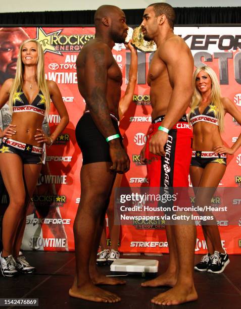 King Mo Lawal and Rafael Feijao react after weighing in for Saturday's Strikeforce MMA event at the Toyota Center Friday, Aug. 20 in Houston.