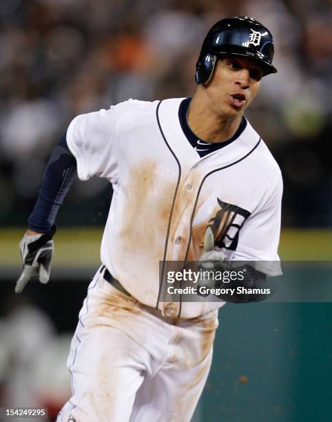 Quintin Berry of the Detroit Tigers rounds third base as he scores on a RBI double by Miguel Cabrera of the Detroit Tigers in the bottom of the fifth...