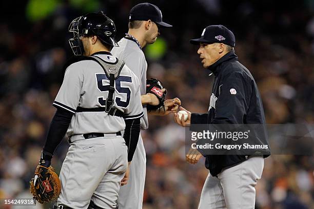 Manager Joe Girardi takes Clay Rapada out of the game in the bottom of the fifth inning against the Detroit Tigers during game three of the American...