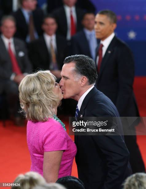 Republican presidential candidate Mitt Romney kisses his wife Ann Romney after a town hall style presidential debate at Hofstra University October...