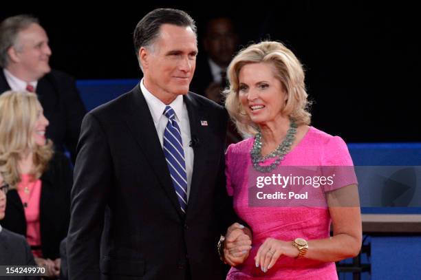 Republican presidential candidate Mitt Romney and wife Ann Romney stand on stage after a town hall style debate at Hofstra University October 16,...