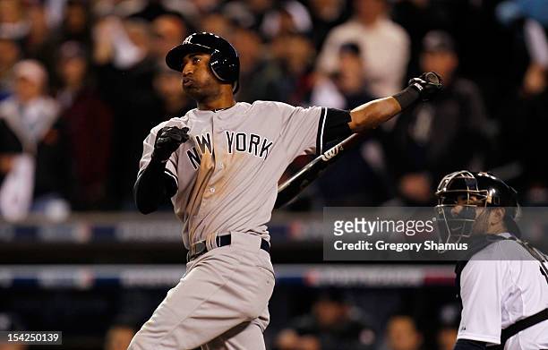 Eduardo Nunez of the New York Yankees hits a solo home run in the top of the ninth inning against the Detroit Tigers during game three of the...