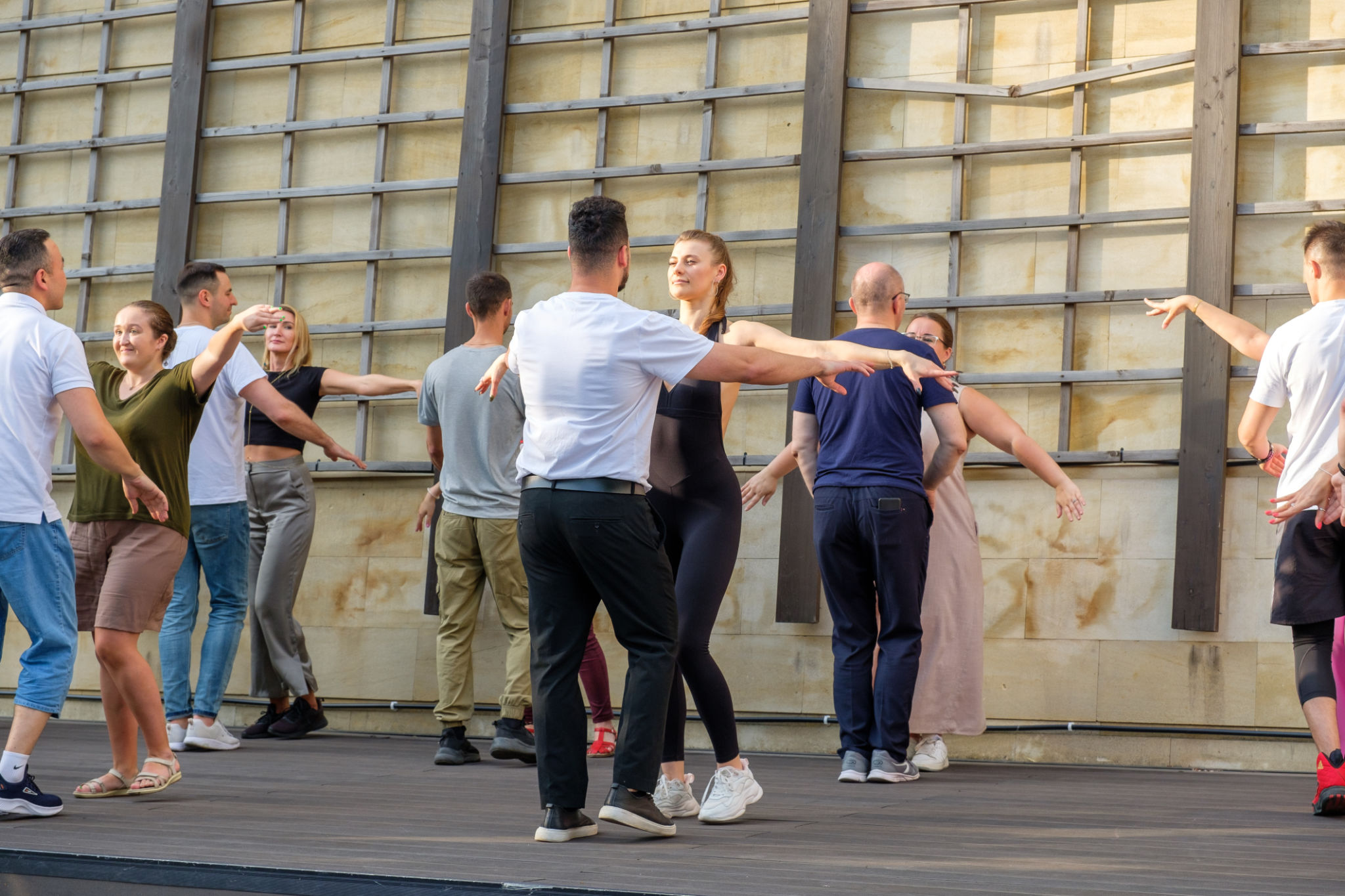 Beautiful couples dance bachata on the street dance floor. Beautiful couples dance bachata on the street dance floor.