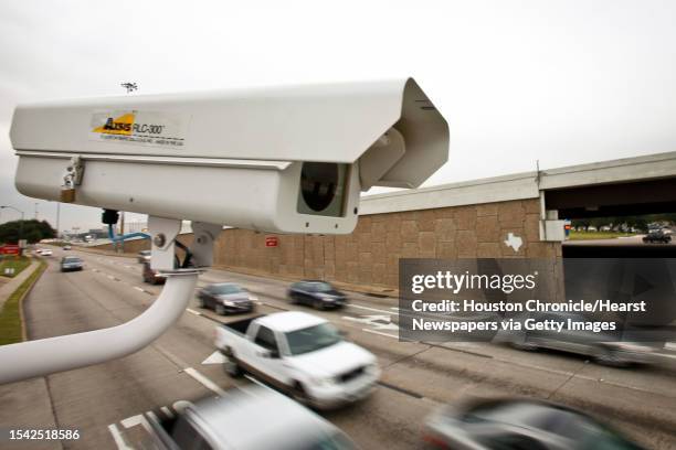 Now defunct red light camera perches above traffic at the intersection of Southwest Freeway and Bellaire Blvd. Monday, Nov. 15 in Houston. The city...