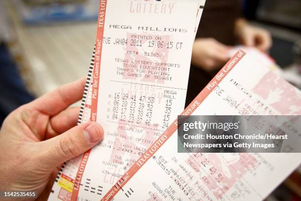 People buy lottery tickets at the Valero Gas Station at Montrose and Westheimer before the $355-million MEGA Millions Jackpot drawing Tuesday, Jan. 4...