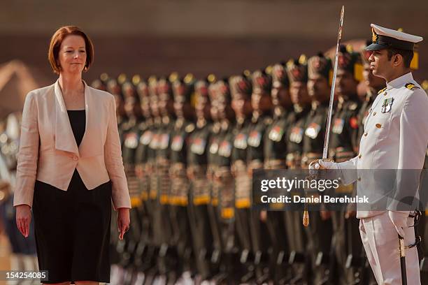 Australian Prime Minister Julia Gillard inspects the guard of honour during her ceremonial reception at the Indian presidential palace Rashtrapati...