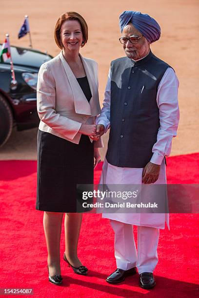 Australian Prime Minister Julia Gillard poses with Indian Prime Minister Manmohan Singh during her ceremonial reception at the Indian presidential...