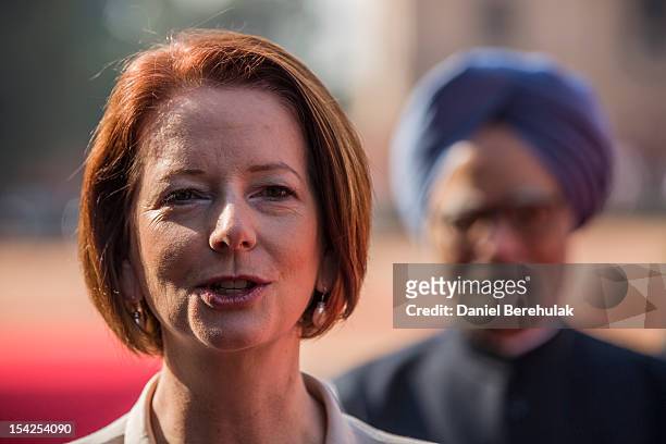Australian Prime Minister Julia Gillard answers a question from the press as Indian Prime Minister Manmohan Singh looks on during her ceremonial...