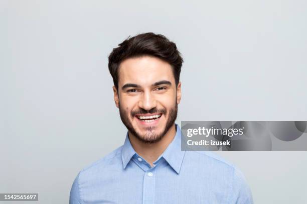 headshot of happy young businessman - business portrait laughing studio stock pictures, royalty-free photos & images