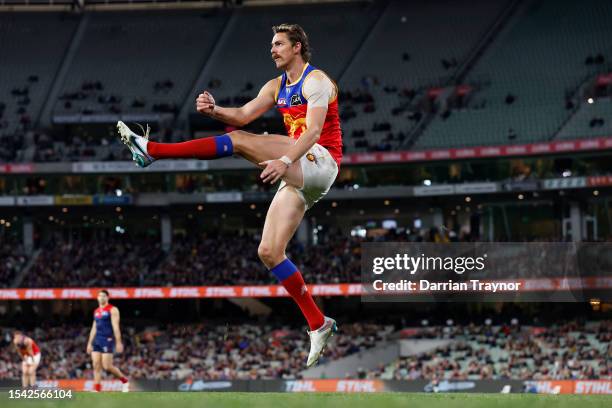 Joe Daniher of the Lions kicks the ball during the round 18 AFL match between Melbourne Demons and Brisbane Lions at Melbourne Cricket Ground, on...