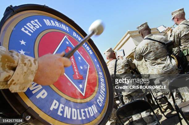 The 82nd Airborne Division's military band, based in Pendleton, California, plays the Army Song during the ceremony of transfer of authority to...