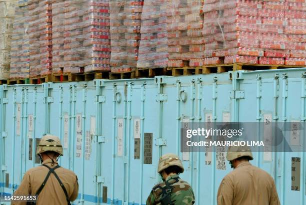 Soldiers from 1-22 Battalion of 4th Infantry Division walk past pop drink refrigerators at 4ID headquarters in Tikrit, 180 kms north of Baghdad, 06...