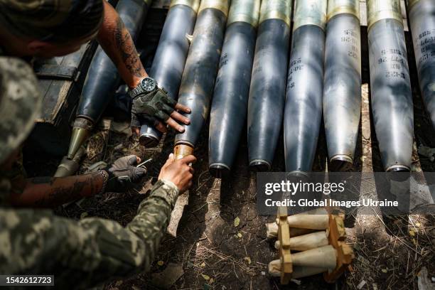 Ukrainian artillerymen load the rockets into a “Grad” multiple rocket launcher on position near Orikhiv on June 27, 2023 in Zaporizhzhia Oblast,...