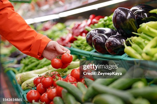 Man shopping vegetables in groceries store Man shopping vegetables in groceries store