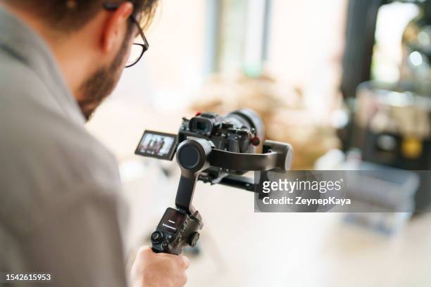 social media content creating with camera on gimbal - cameraman stock pictures, royalty-free photos & images