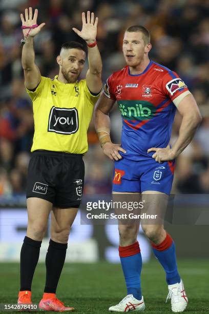Referee Peter Gough sends Jack Hetherington of the Knights to the sin bin for 10 minutes during the round 20 NRL match between Newcastle Knights and...