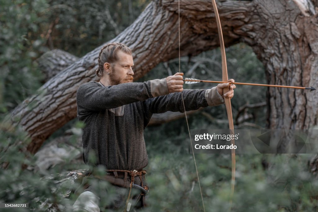 An individual viking archer warrior in a forest