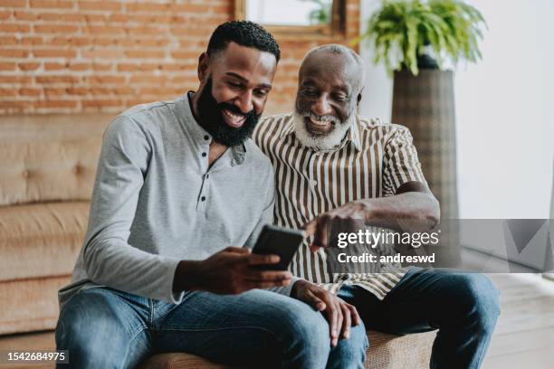 senior father and eldest son - grandpa son stock pictures, royalty-free photos & images