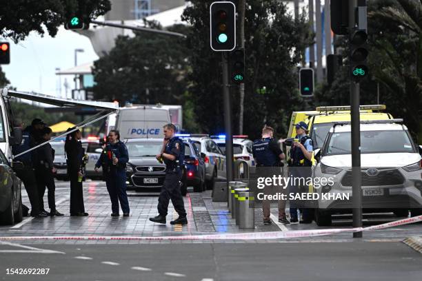 Police officers cordon off the site of a shooting in central Auckland on July 20, 2023. New Zealand's prime minister said a shooting that killed two...