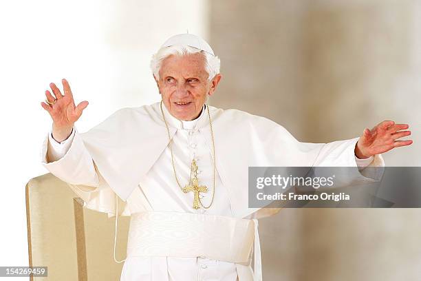 Pope Benedict XVI waves to the faithful gathered in St. Peter's square during his weekly audience on October 17, 2012 in Vatican City, Vatican....