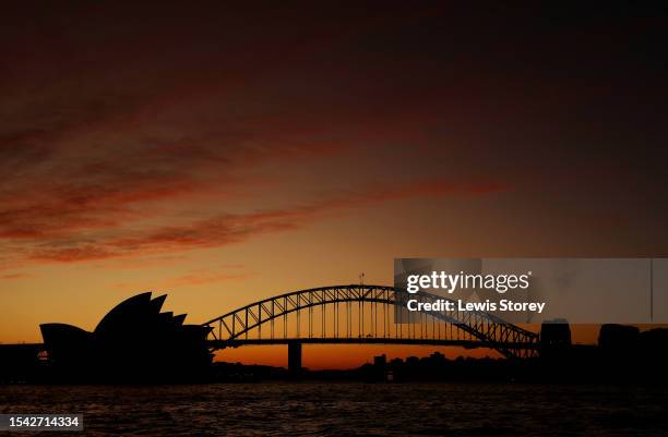 The Sydney Opera House and Sydney Harbour Bridge are seen as the sun sets ahead of the FIFA World Cup Australia & New Zealand 2023 on July 14, 2023...