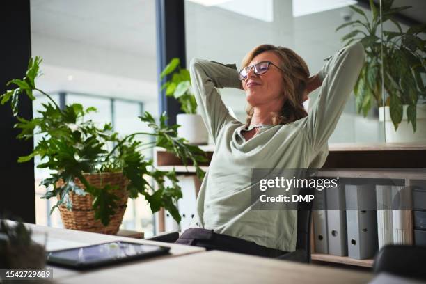 sleep, relax and business woman finished with working on a project in office. success, peace and calm with happy person resting after job complete, hands behind head and stretching for zen in company - relax bildbanksfoton och bilder