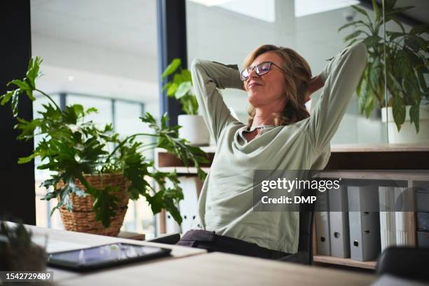 sleep, relax and business woman finished with working on a project in office. success, peace and calm with happy person resting after job complete, hands behind head and stretching for zen in company - stillsam människa bildbanksfoton och bilder