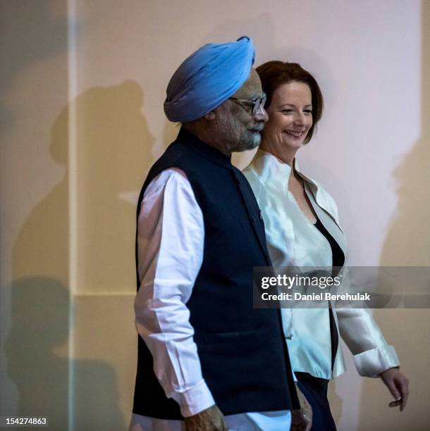 Australian Prime Minister Julia Gillard walks with Indian Prime Minister Manmohan Singh prior to delegation level talks at Hyderabad House on October...