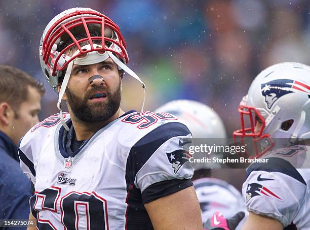 Rob Ninkovich of the New England Patriots looks at the scoreboard during a game against the Seattle Seahawks at CenturyLink Field on October 14, 2012...