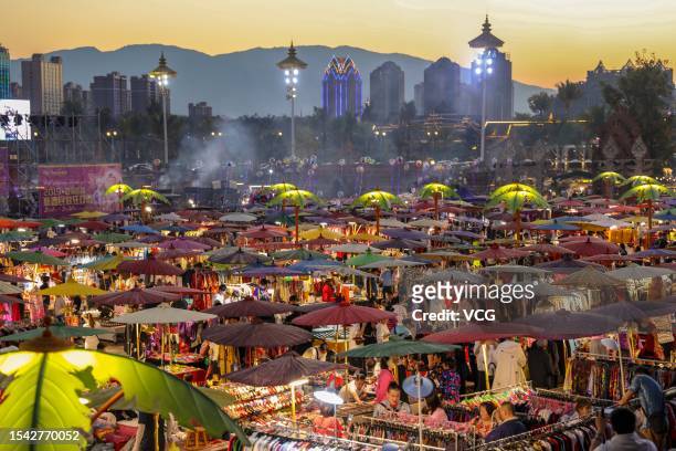 General view of the Starlight Night Market along the Lancang-Mekong River, featuring local food and creative handicrafts by the young, on July 13,...