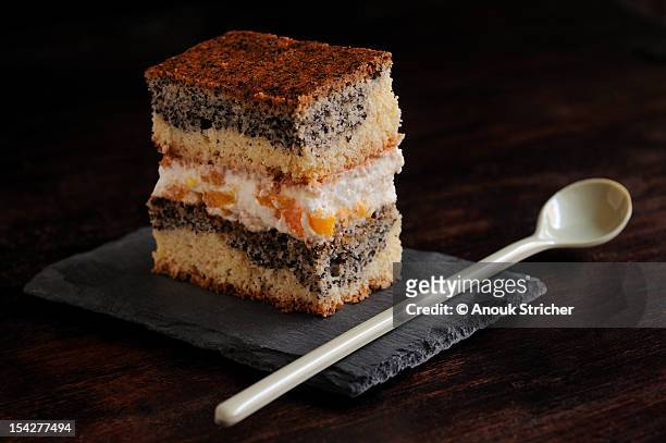 layer cake with poppy seeds - poppy seed stock pictures, royalty-free photos & images