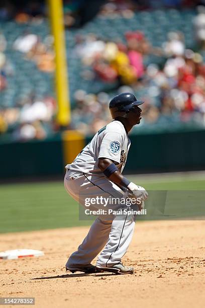 Trayvon Robinson of the Seattle Mariners leads off second base during the game against the Los Angeles Angels of Anaheim on August 12, 2012 at Angel...