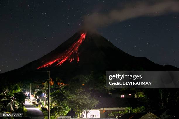 Volcano Merapi spews lava during an eruption seen from Wonokerto village in Sleman on July 20, 2023.