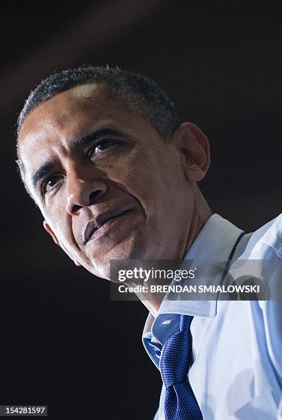 President Barack Obama pauses while speaking during a rally at Cornell College October 17, 2012 in Mt. Vernon, Iowa. Obama is traveling to Iowa and...