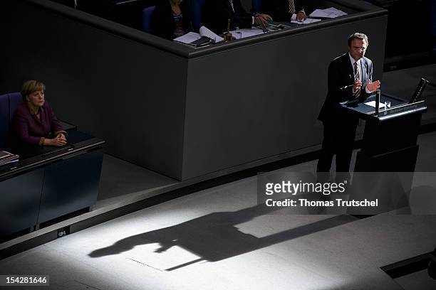 German Interior Minister Hans-Peter Friedrich speeks during a debate on the anti-Semitism report at Reichstag, the seat of the German Parliament , on...