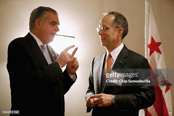 Transportation Secretary Ray LaHood and JetBlue CEO Dave Barger talk during an Aero Club luncheon at the Captial Hilton October 17, 2012 in...