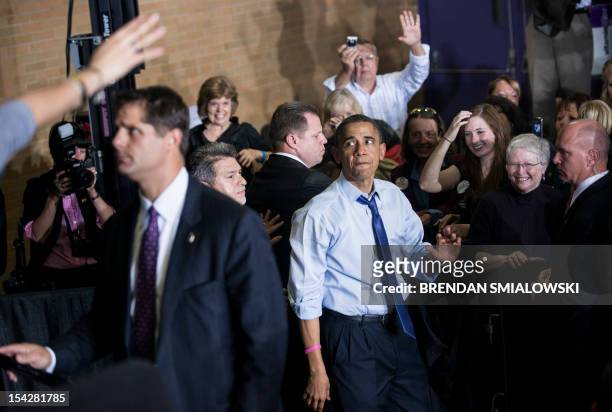 President Barack Obama greets supporters after speaking at a rally at Cornell College October 17, 2012 in Mt. Vernon, Iowa. Obama is traveling to...