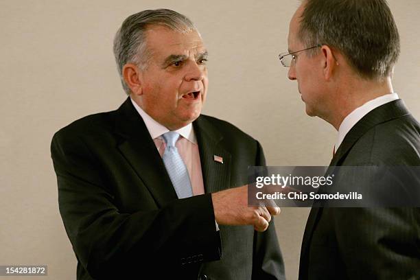 JetBlue CEO Dave Barger talks with Transportation Secretary Ray LaHood during an Aero Club luncheon at the Captial Hilton October 17, 2012 in...