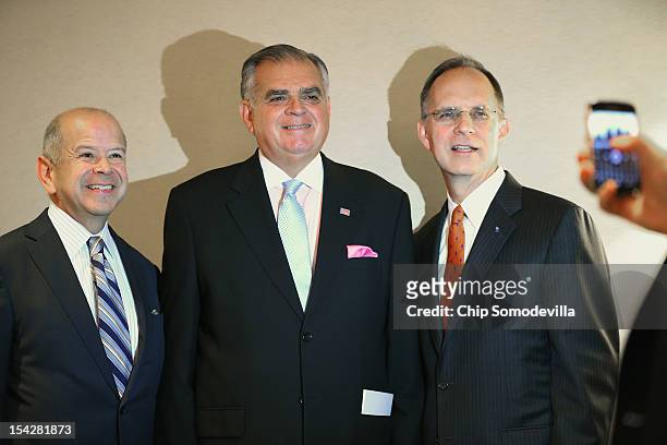 Acting Administrator of the Federal Aviation Administration Michael Huerta, Transportation Secretary Ray LaHood and JetBlue CEO Dave Barger pose for...