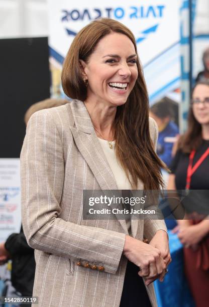 Catherine, Princess of Wales laughs as she shakes a joke with Cadets in the Techno Zone, which aims to inspire young people into exploring science,...