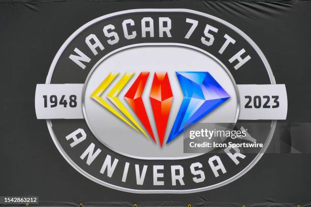 Detail view of the NASCAR 75th anniversary logo on a banner before the NASCAR Cup Series Crayon 301 on July 17 at New Hampshire Motor Speedway in...