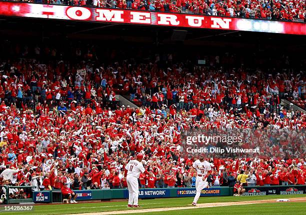 Matt Carpenter of the St. Louis Cardinals rounds the bases after he hits a two-run home run in the third inning against the San Francisco Giants in...