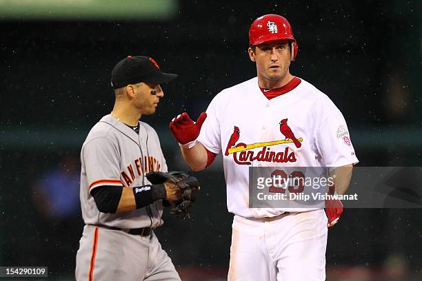 David Freese of the St. Louis Cardinals reacts on second base after he hits a double in the seventh inning against the San Francisco Giants in Game...