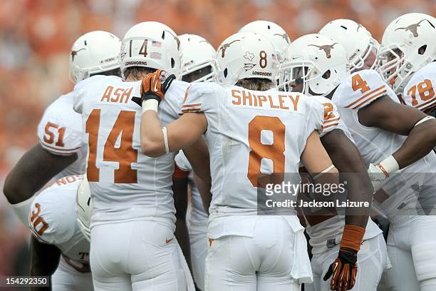 Quarterback David Ash of the Texas Longhorns calls a huddle during their game against the Oklahoma Sooners on October 13, 2012 at The Cotton Bowl in...